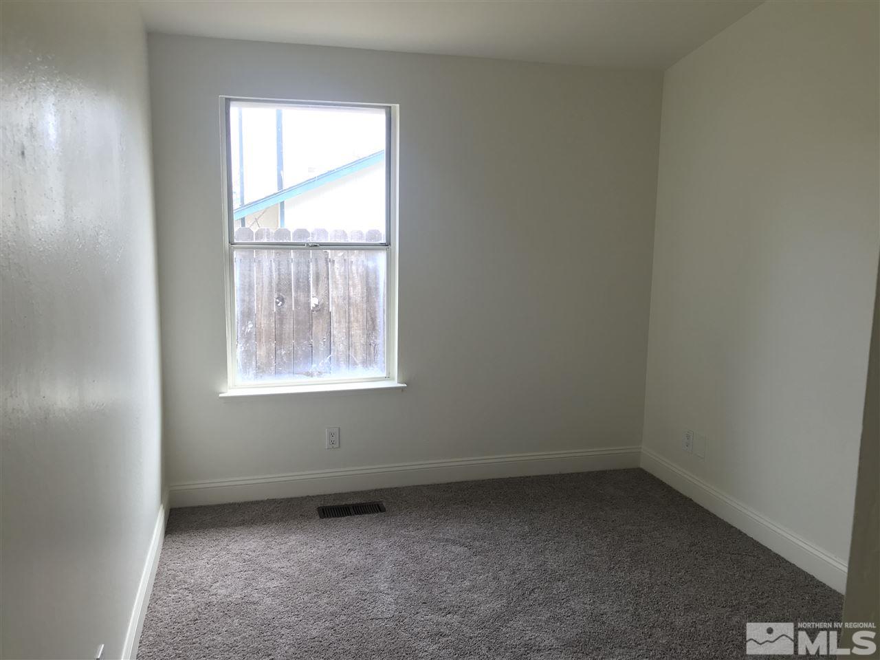 6325 Walnut Creek Road Reno, NV 89523 - Photo 8 of 10 an empty room with a window