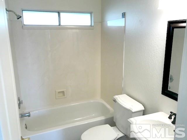6325 Walnut Creek Road Reno, NV 89523 - Photo 9 of 10 a bathroom with a bathtub toilet and sink