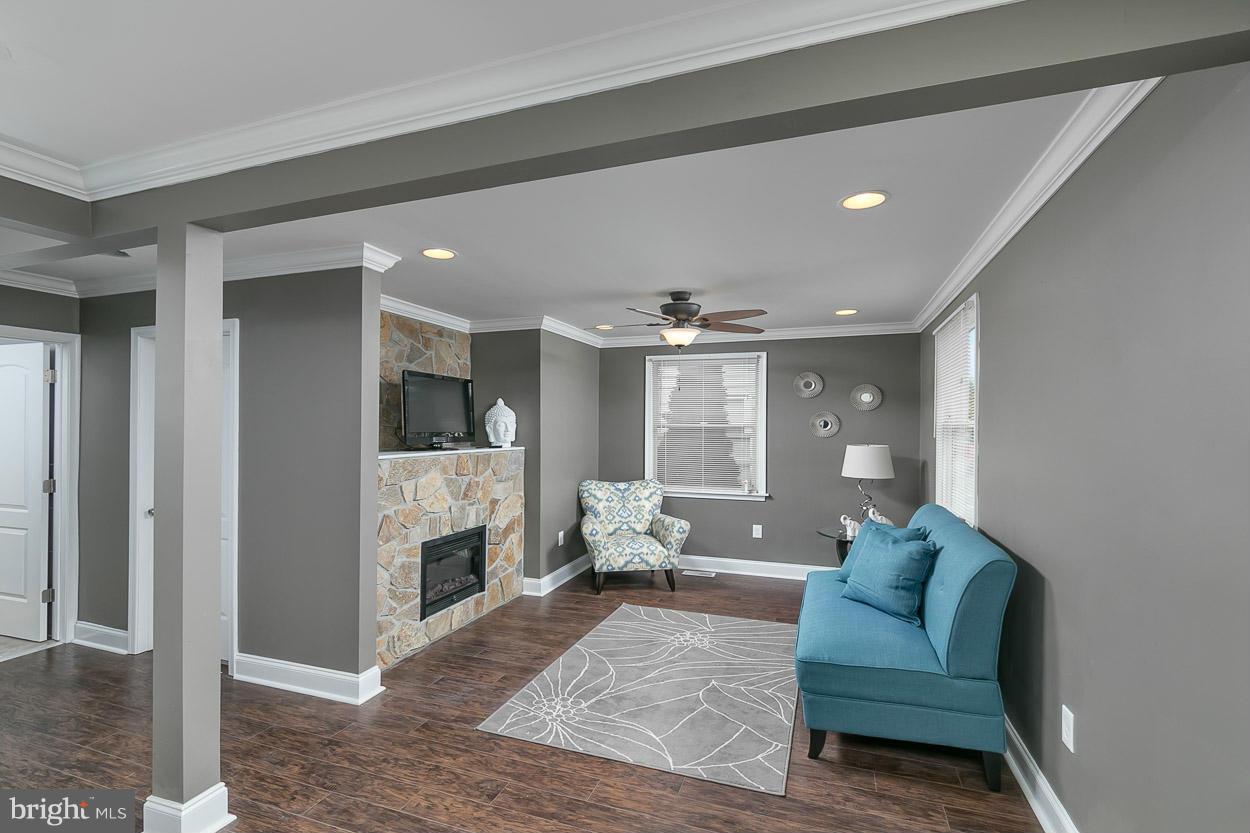 8221 Longpoint Road Baltimore, MD 21222 - Photo 4 of 24 a living room with furniture and a fireplace