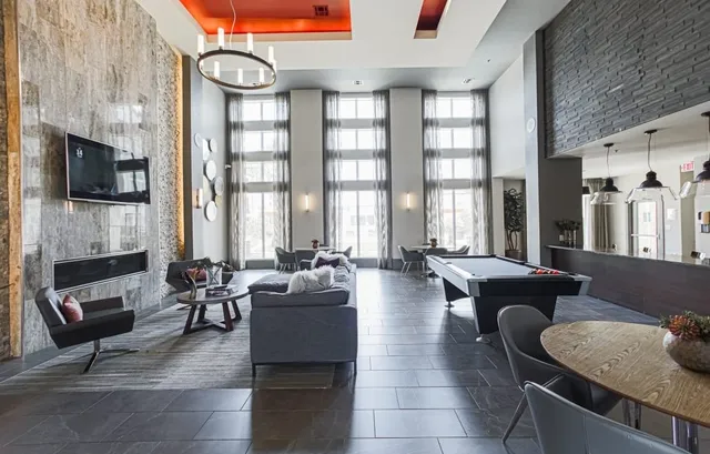 a living room with fireplace furniture and a flat screen tv