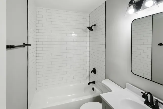 a bathroom with a bathtub and shower