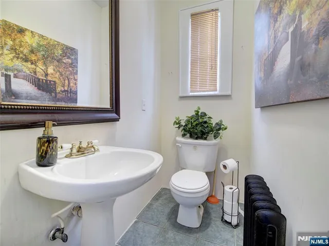 a view of hall way with furniture and wooden floor