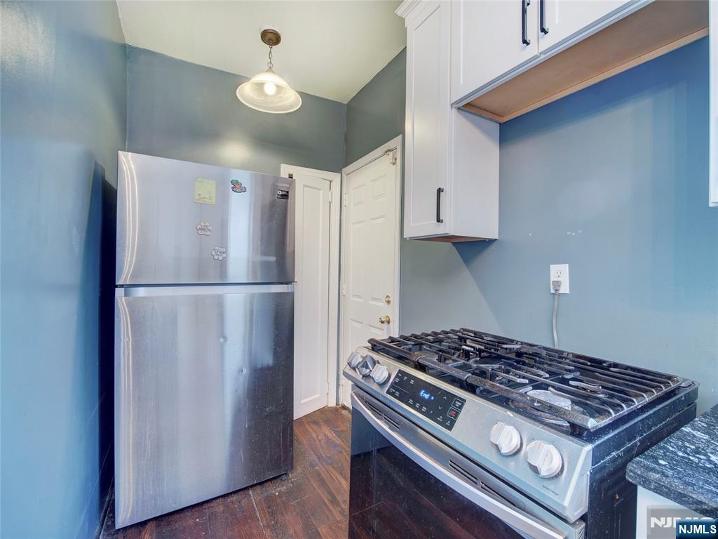 5 Park Road Paterson, NJ 07514 - Photo 14 of 30 a kitchen with a stove and a refrigerator