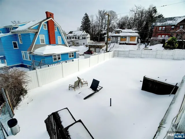 a view of roof deck with furniture and barbeque oven