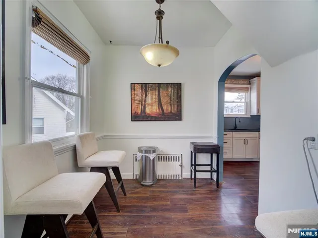 a view of a livingroom with furniture and wooden floor