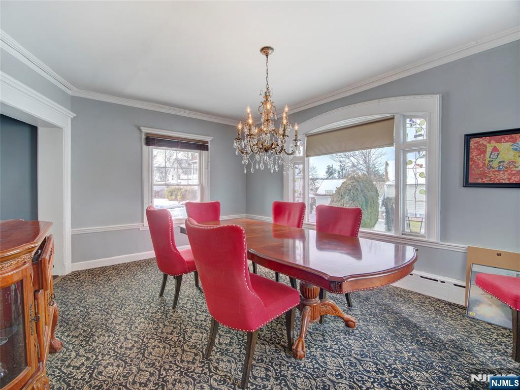 5 Park Road Paterson, NJ 07514 - Photo 18 of 30 a dining room with furniture a chandelier and window