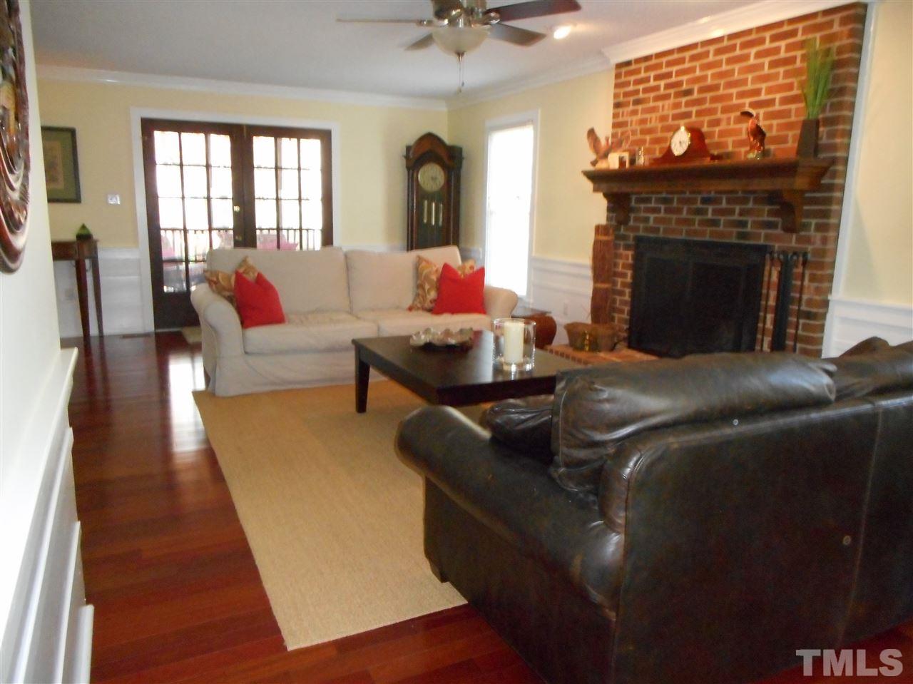 2616 Howard Road Raleigh, NC 27613 - Photo 2 of 16 a living room with furniture and a fireplace
