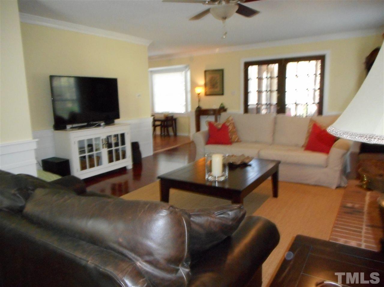 2616 Howard Road Raleigh, NC 27613 - Photo 3 of 16 a living room with furniture and a flat screen tv