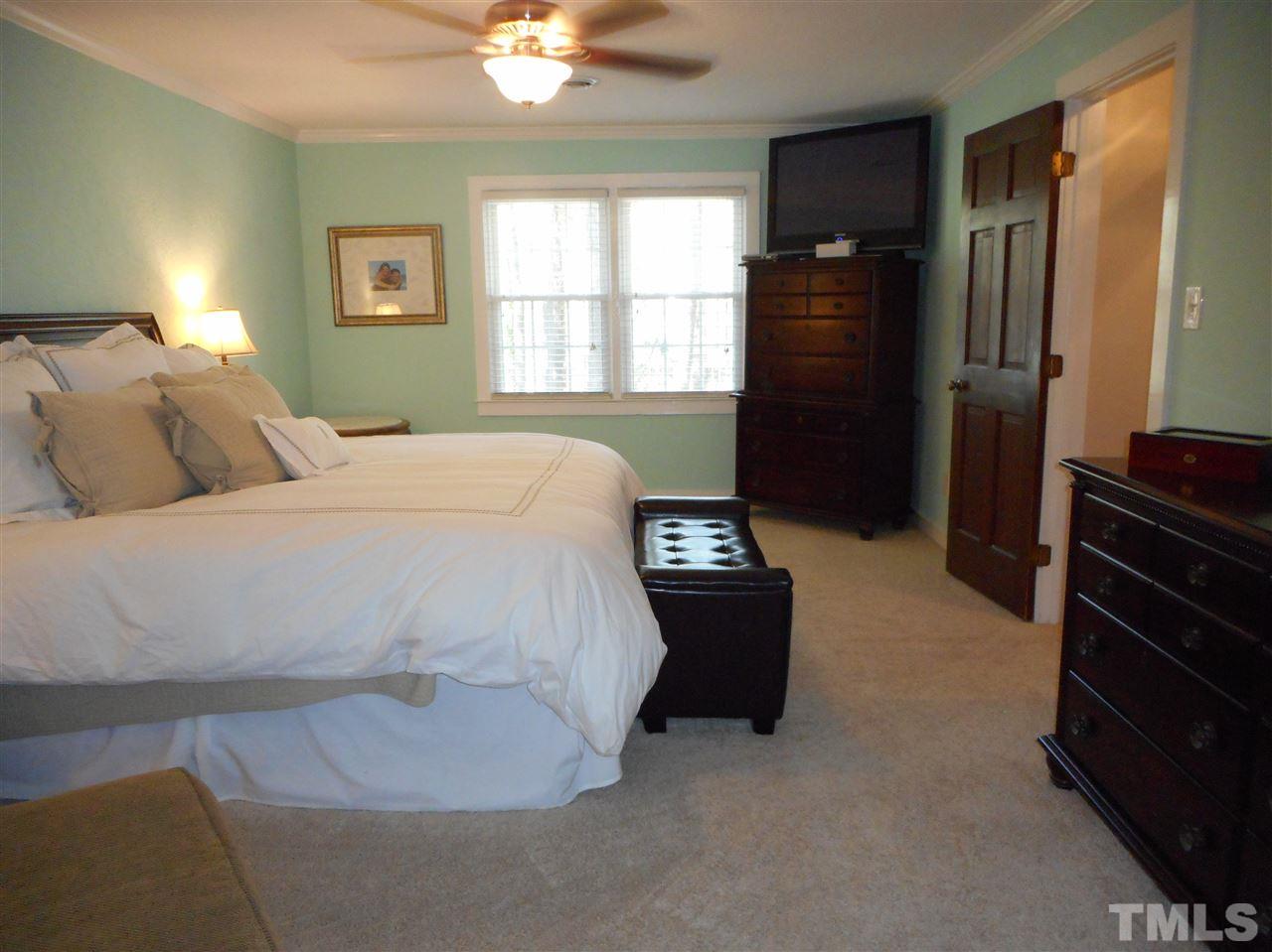 2616 Howard Road Raleigh, NC 27613 - Photo 10 of 16 a bedroom with a bed and a dresser