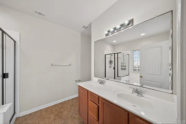 a bathroom with bathtub and shower