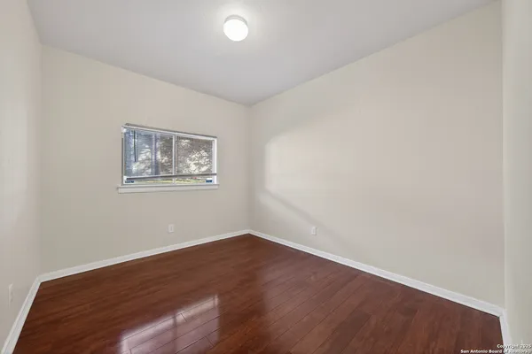 a bathroom with a sink mirror toilet and bathtub