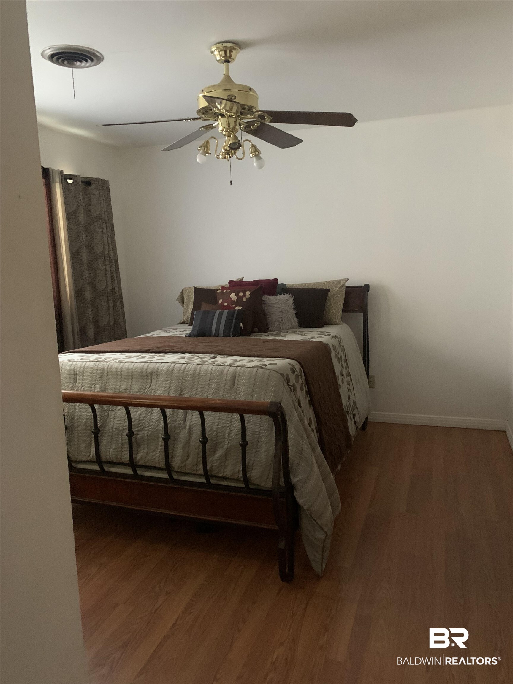 5467 Racine Avenue Mobile, AL 36618 - Photo 7 of 11 Bedroom featuring dark hardwood / wood-style flooring and ceiling fan