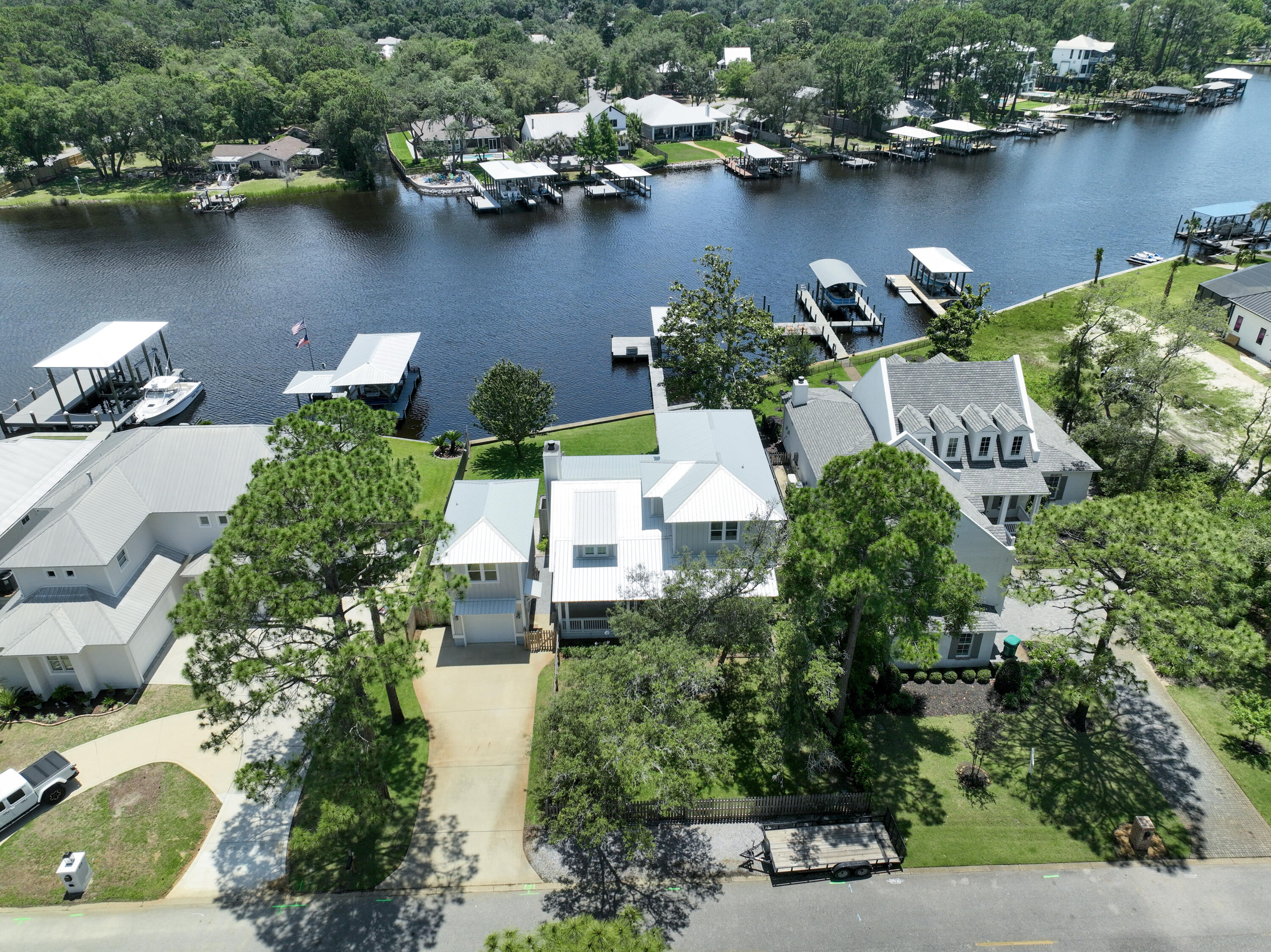 an aerial view of a houses with a lake view