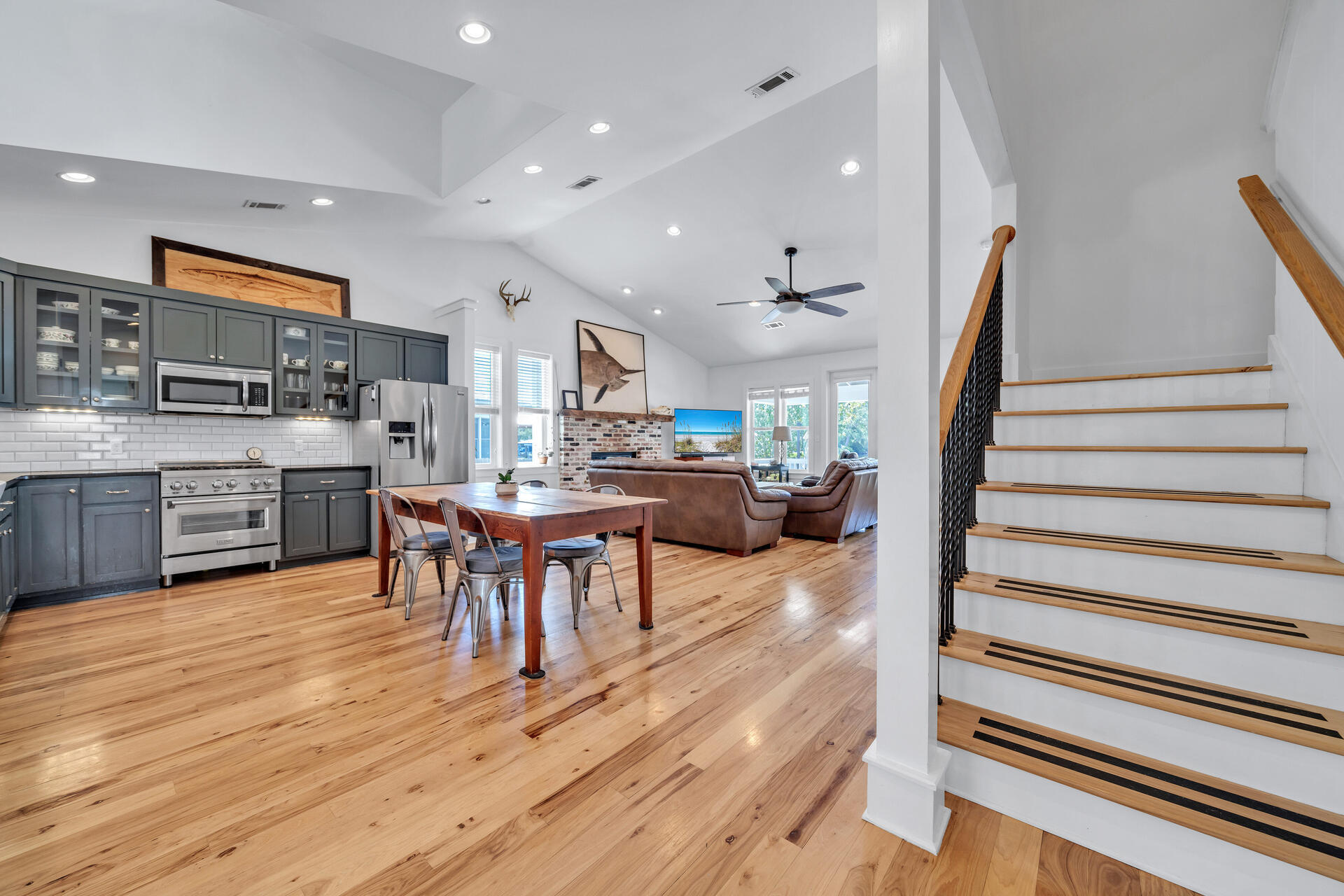 192 Buck Road Santa Rosa Beach, FL 32459 - Photo 11 of 74 a living room with stainless steel appliances furniture wooden floor and a kitchen view