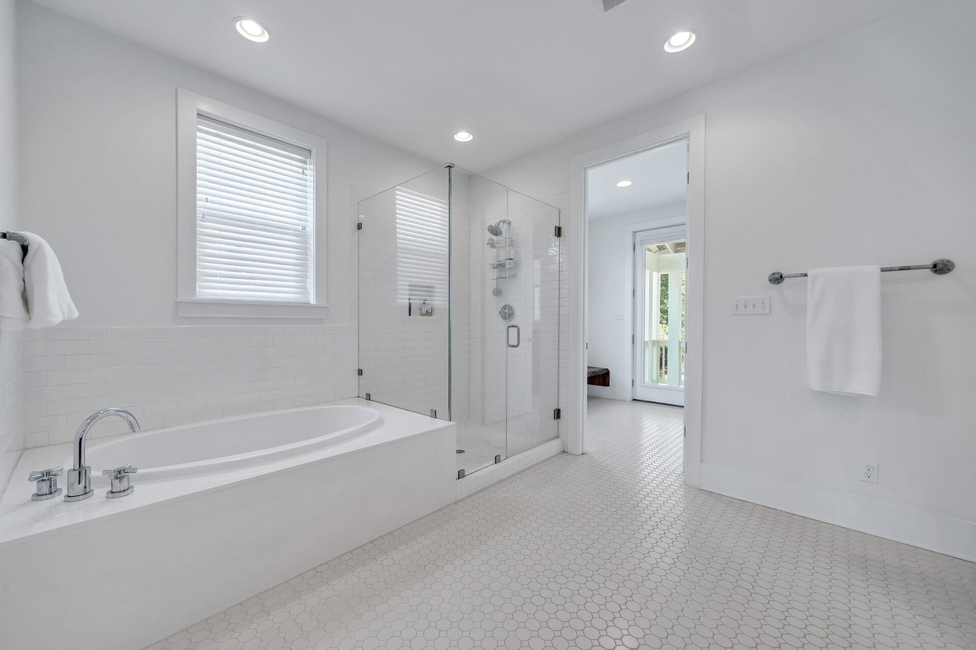 192 Buck Road Santa Rosa Beach, FL 32459 - Photo 25 of 74 a spacious bathroom with a bathtub shower and a sink