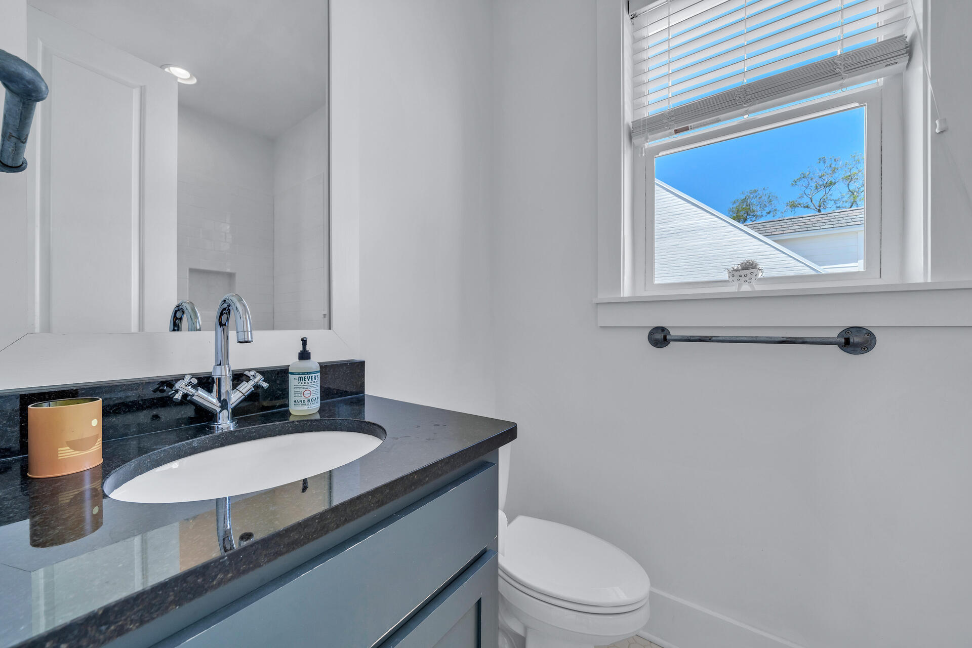 192 Buck Road Santa Rosa Beach, FL 32459 - Photo 33 of 74 a bathroom with a toilet a sink and mirror