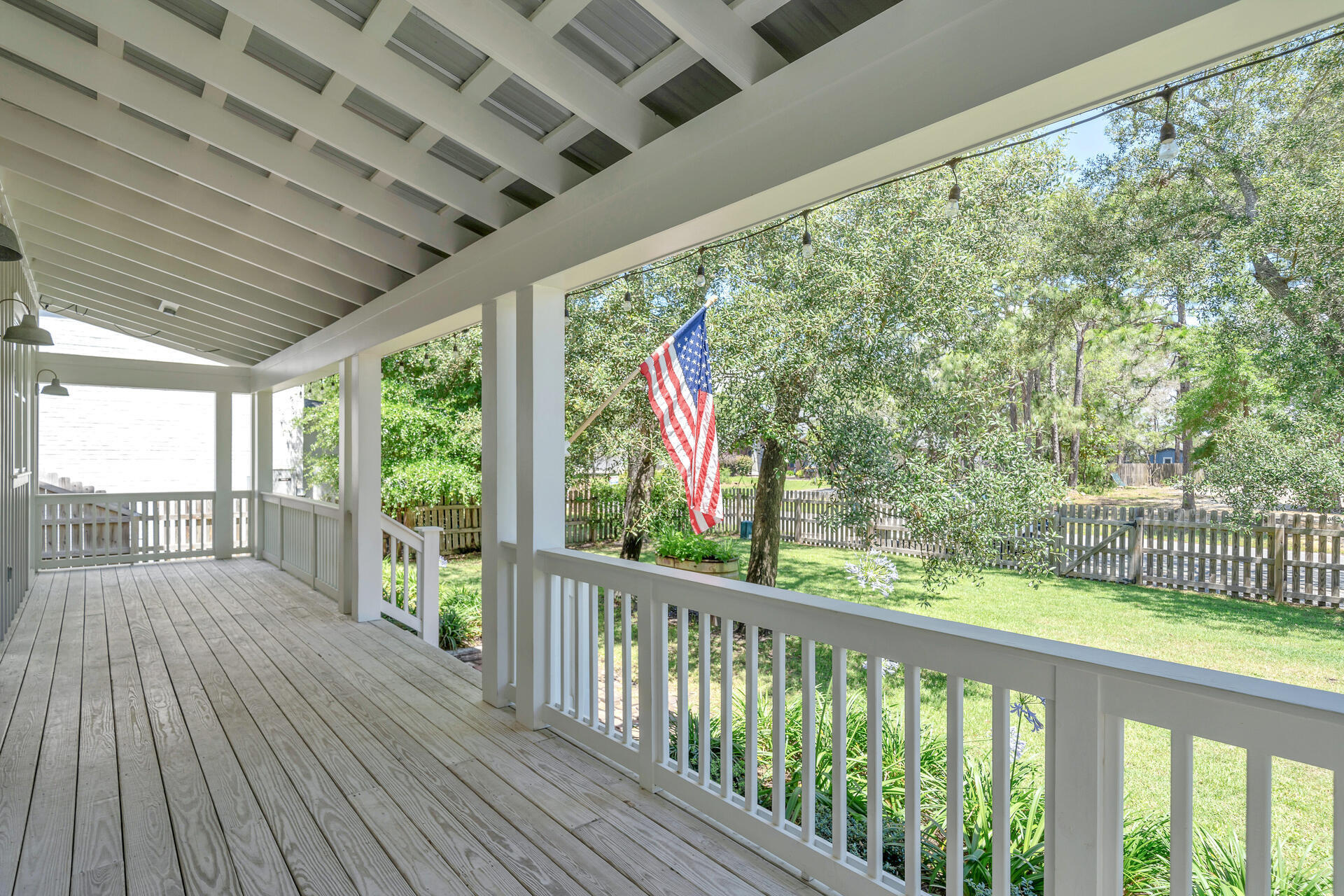 192 Buck Road Santa Rosa Beach, FL 32459 - Photo 39 of 74 a view of a porch with wooden floor in front of house