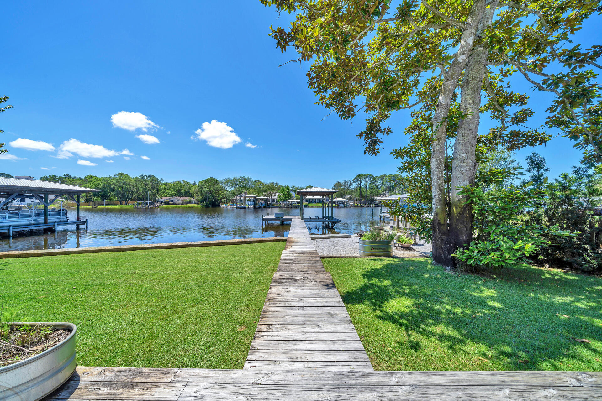 192 Buck Road Santa Rosa Beach, FL 32459 - Photo 51 of 74 a view of a lake with a yard