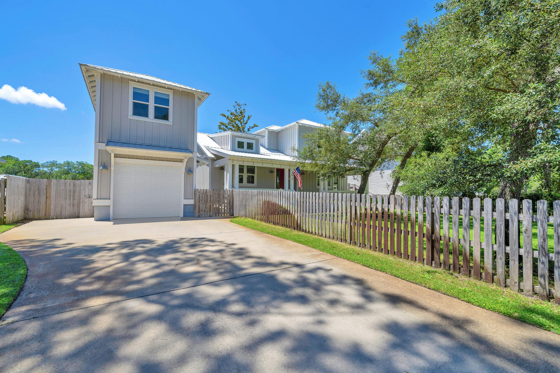 192 Buck Road Santa Rosa Beach, FL 32459 - Photo 6 of 74 a view of a house with a backyard