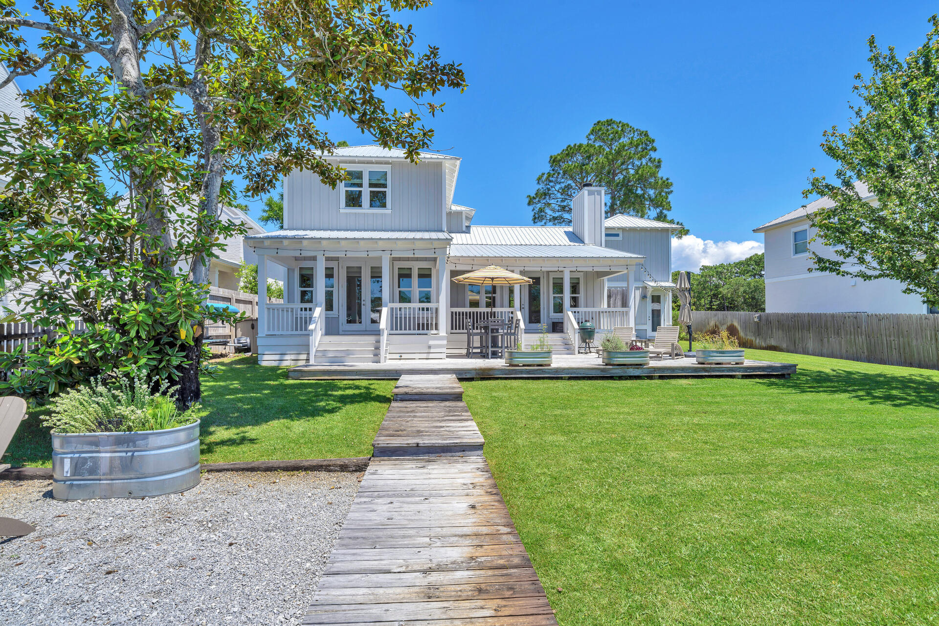 192 Buck Road Santa Rosa Beach, FL 32459 - Photo 64 of 74 a front view of a house with garden