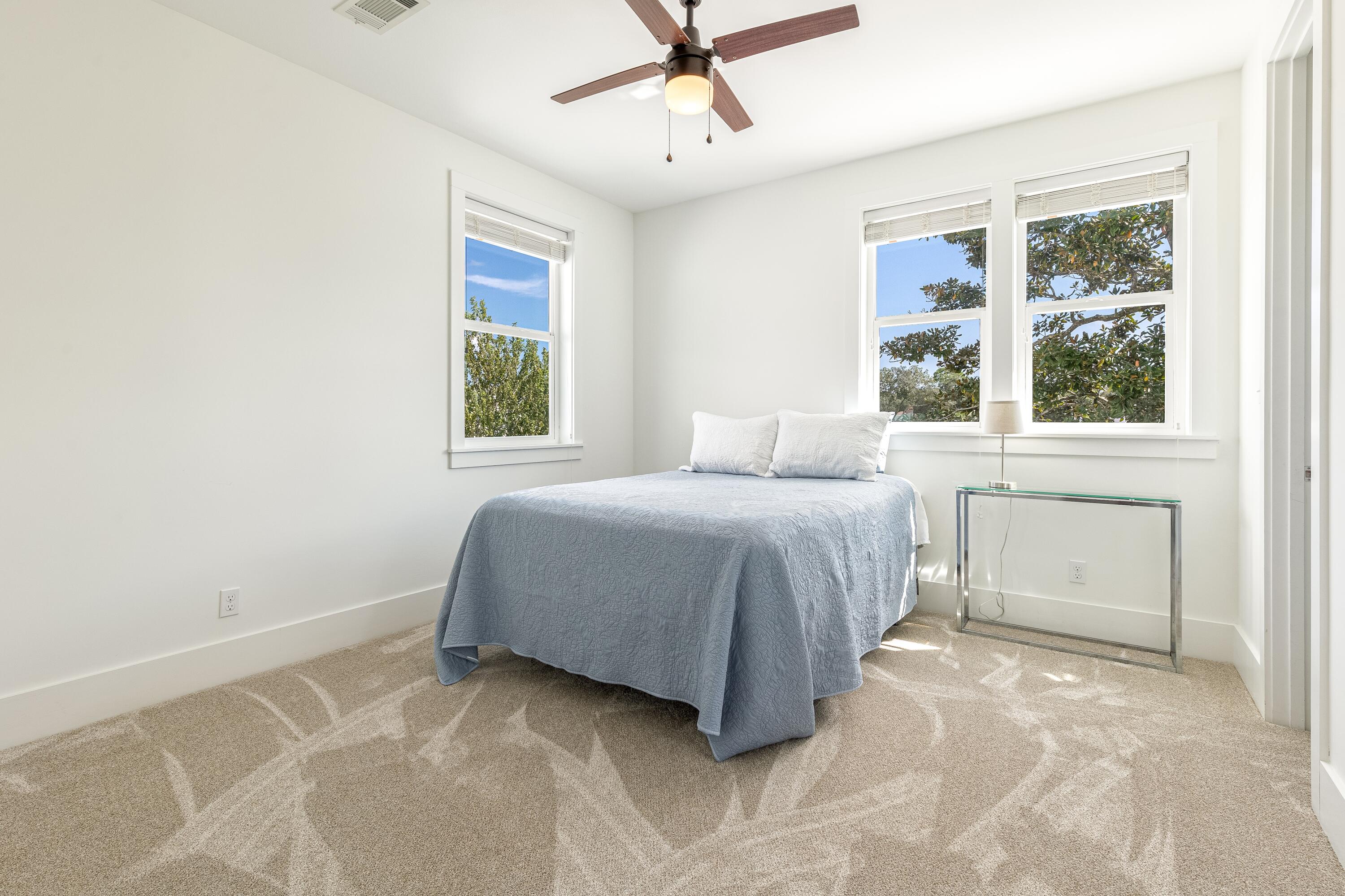192 Buck Road Santa Rosa Beach, FL 32459 - Photo 69 of 74 a bedroom with a bed and a window