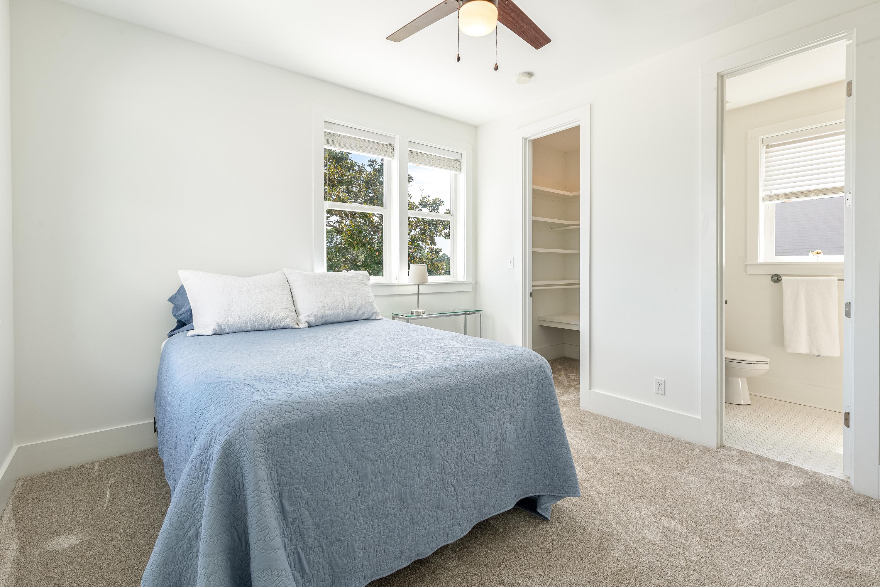 192 Buck Road Santa Rosa Beach, FL 32459 - Photo 71 of 74 a bedroom with a bed and a window