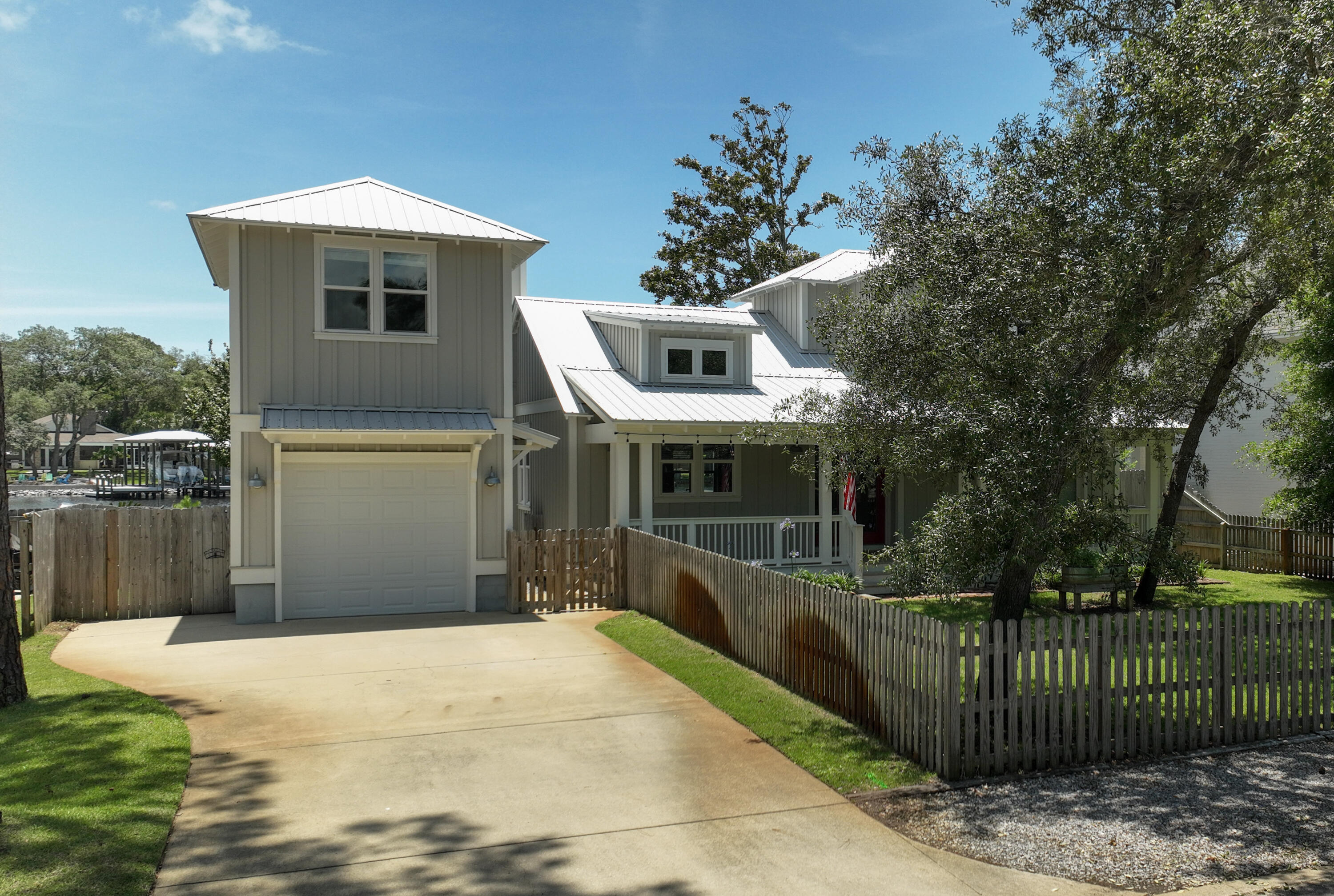 192 Buck Road Santa Rosa Beach, FL 32459 - Photo 10 of 74 a front view of a house with a garden