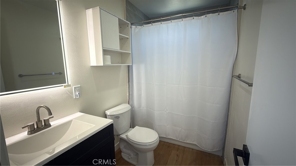 716 West Church Avenue Ridgecrest, CA 93555 - Photo 8 of 13 a bathroom with a sink a toilet and a mirror