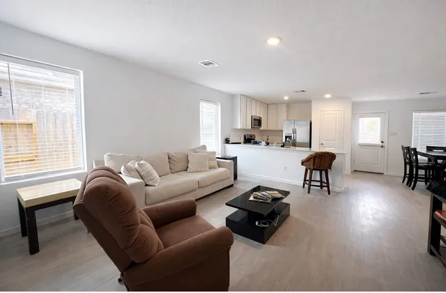 a living room with furniture and a window