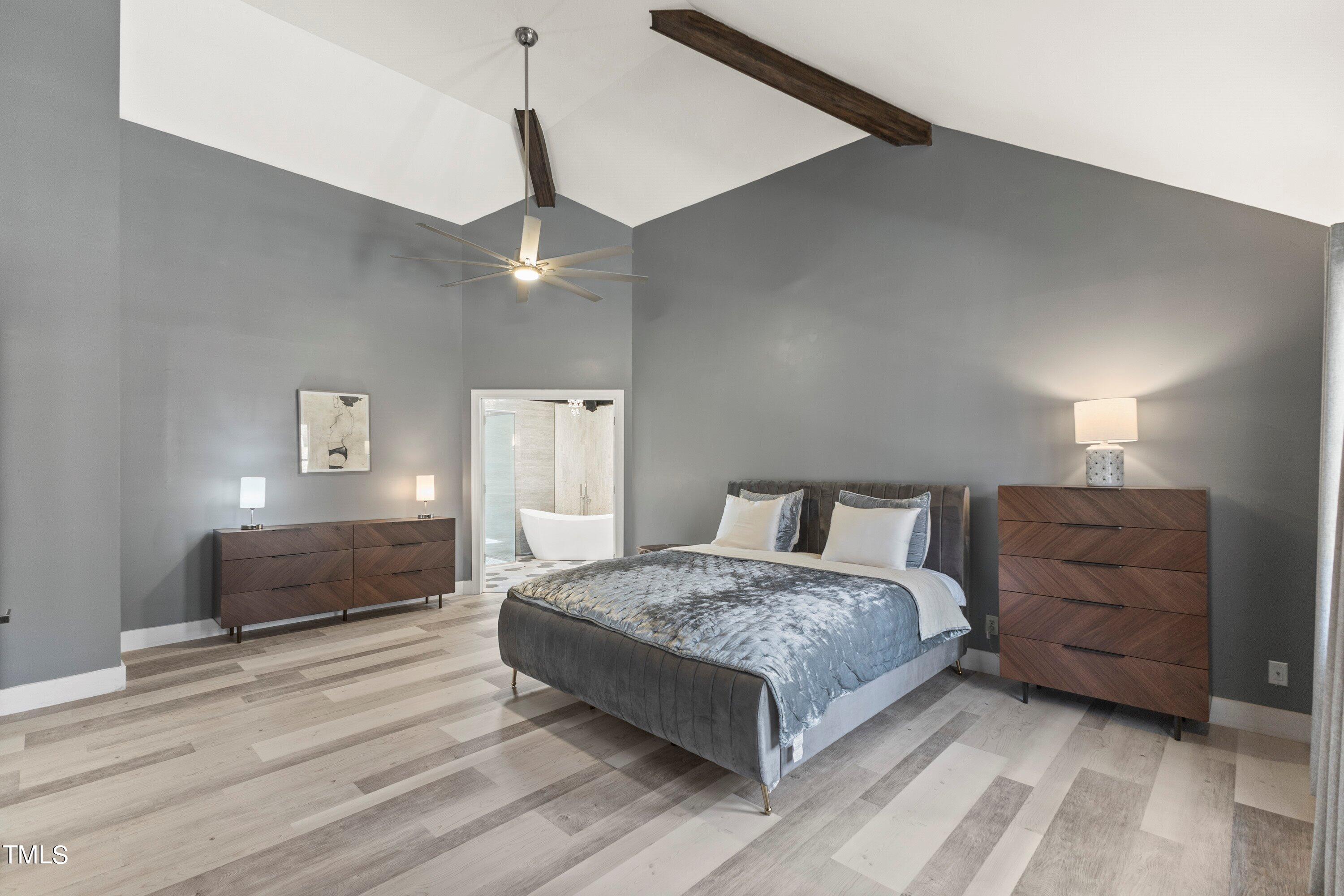 6204 Trevor Court Raleigh, NC 27613 - Photo 38 of 68 a bedroom with a bed and ceiling fan