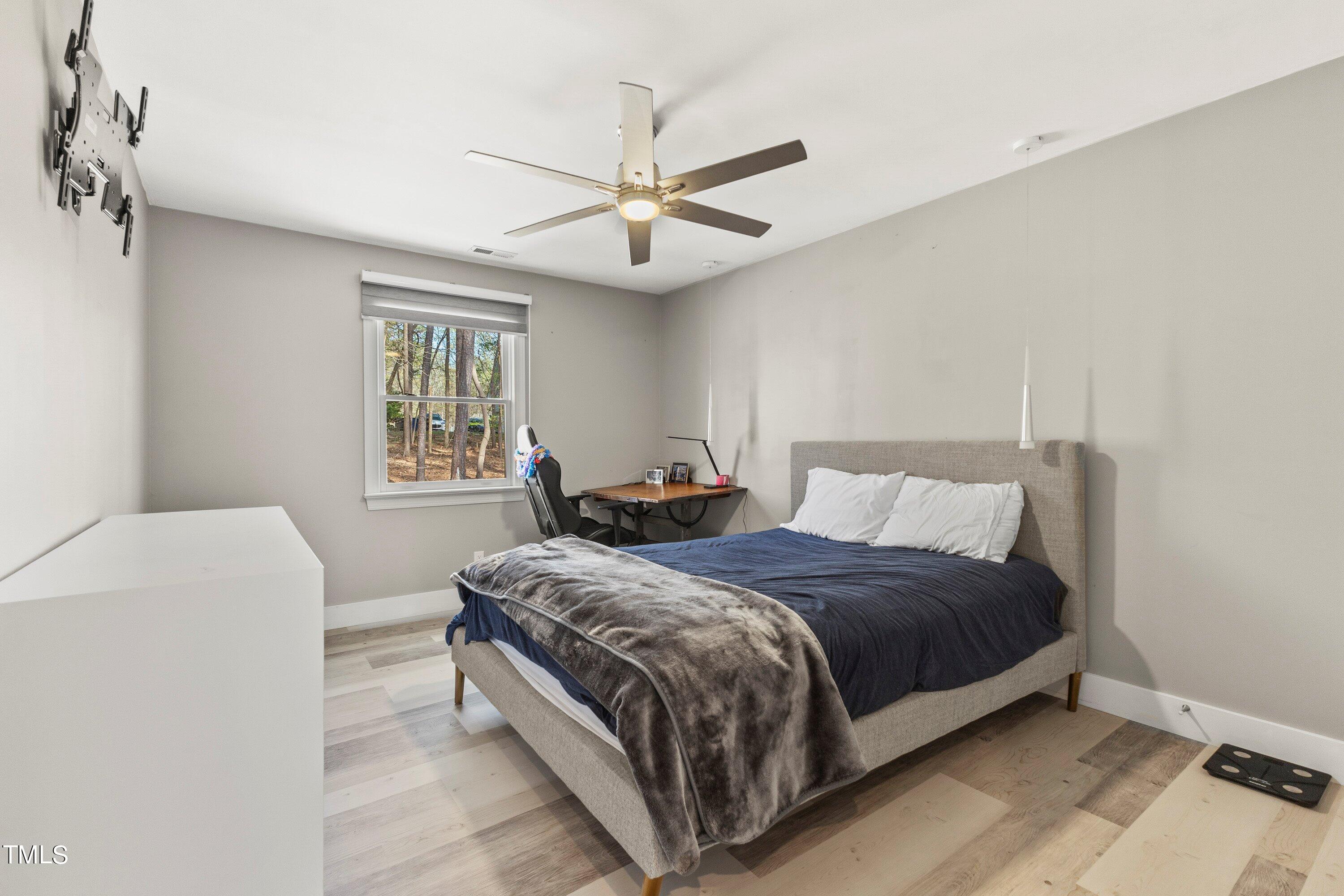 6204 Trevor Court Raleigh, NC 27613 - Photo 52 of 68 a bedroom with a bed and window