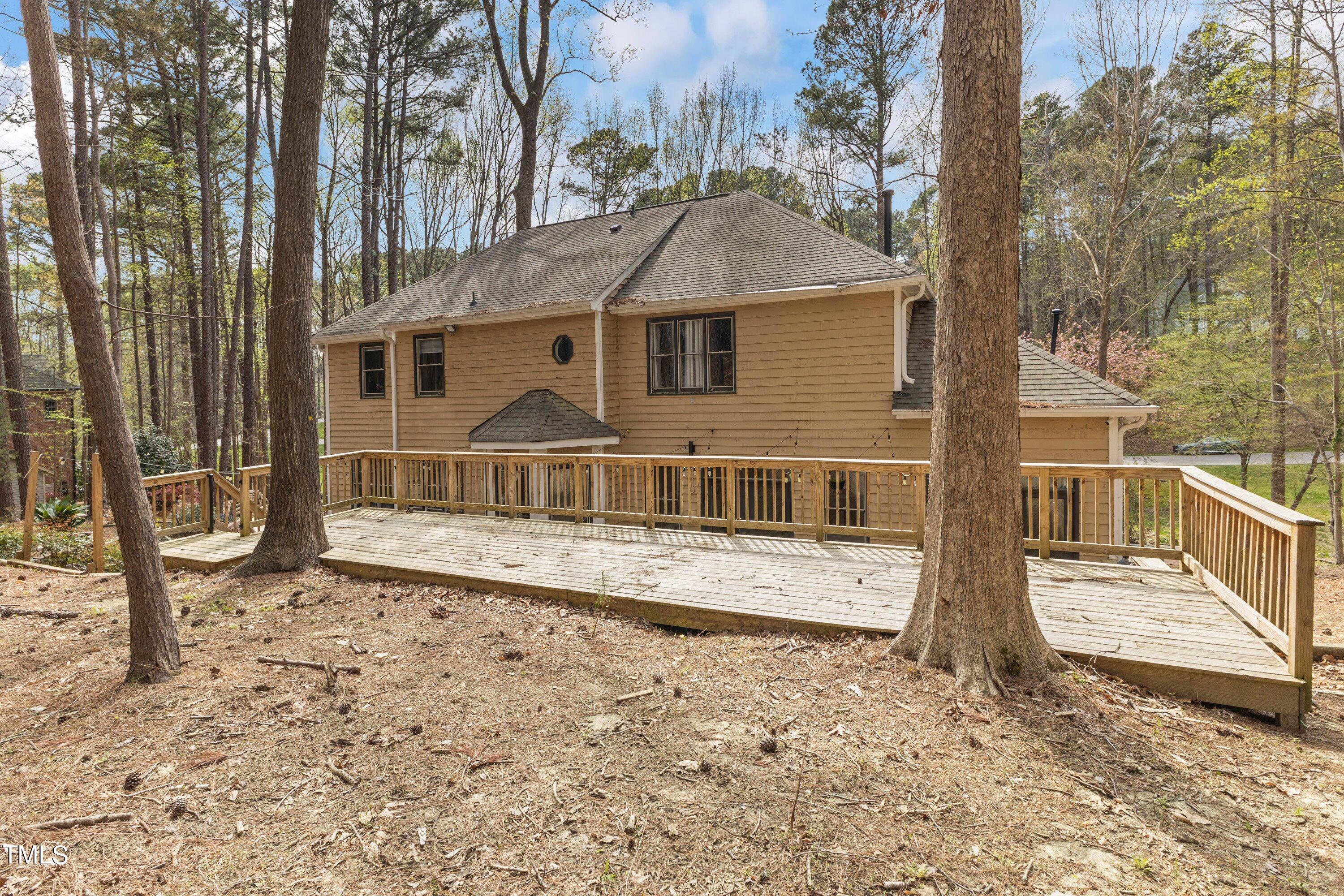 6204 Trevor Court Raleigh, NC 27613 - Photo 58 of 68 a view of a house with a wooden fence