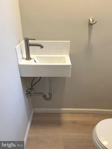 a bathroom with a sink and mirror