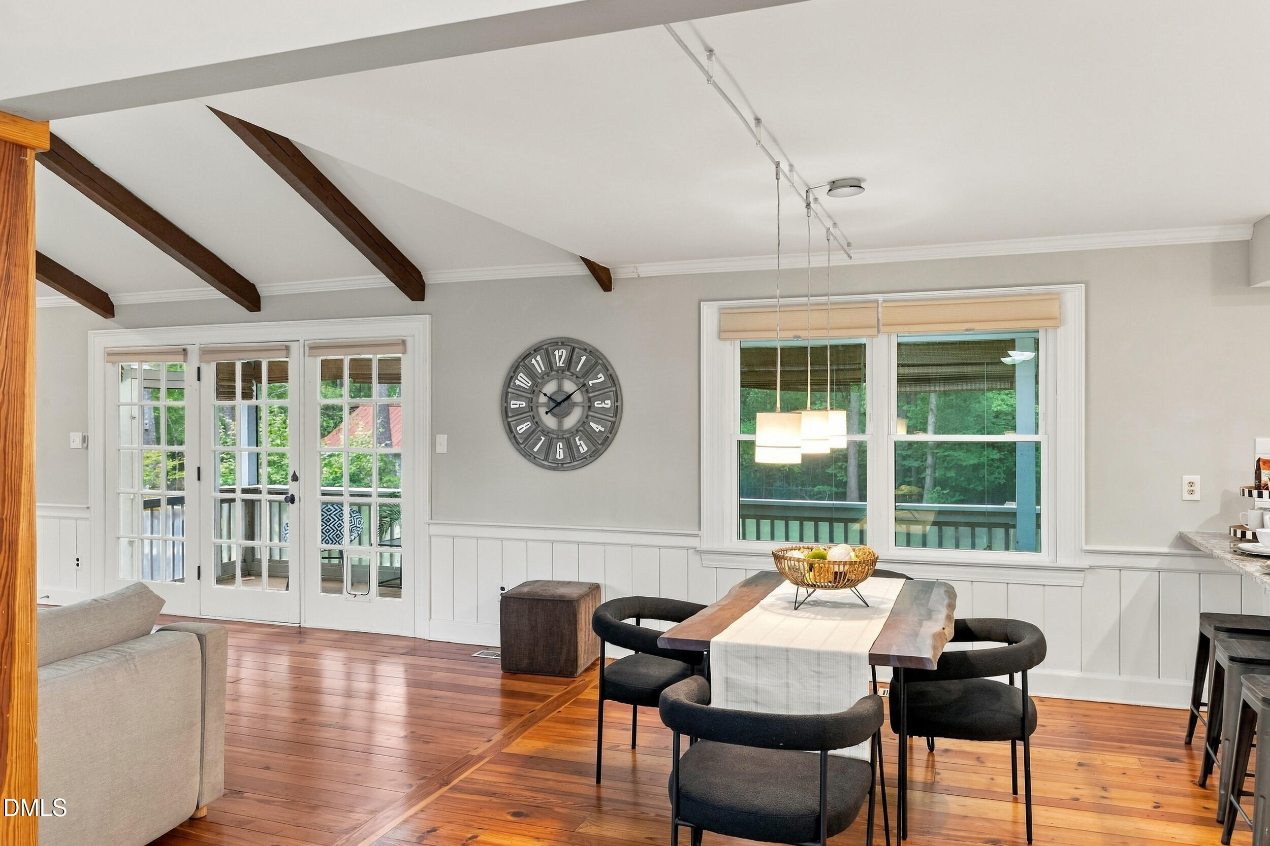 2329 Win Road Garner, NC 27529 - Photo 16 of 90 Vaulted ceiling with exposed wood beams, wood-finish flooring, French doors, white paneled wainscoting, and large windows