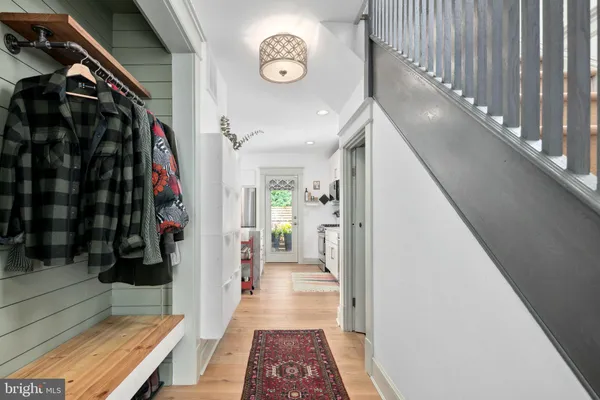 a view of a hallway with wooden floor and a hallway