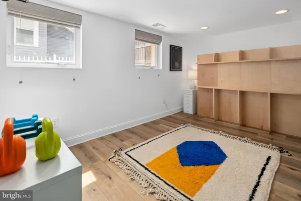 a bedroom with bed and a window