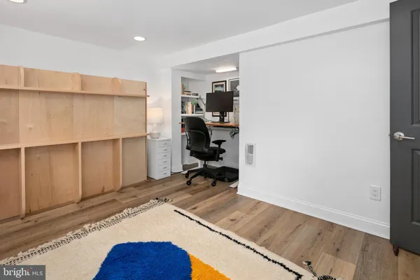 a view of a bedroom with wooden floor and bedroom
