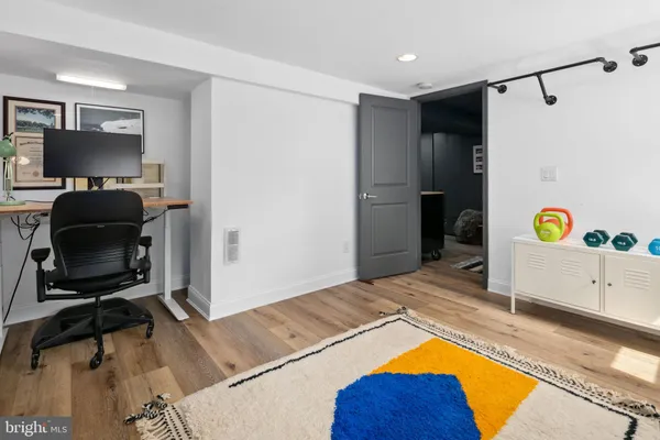 a bedroom with a bed and a chair in it