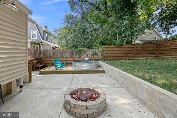 a view of a backyard with sitting area