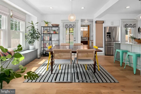 a living room with furniture and a book shelf