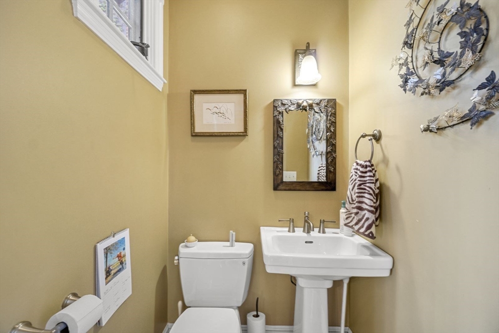65 Rutherford Avenue Boston, MA 02129 - Photo 14 of 25 a bathroom with a sink mirror and toilet