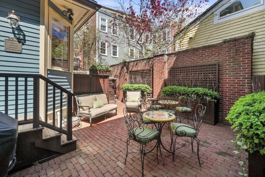 65 Rutherford Avenue Boston, MA 02129 - Photo 17 of 25 a view of a patio with couches table and chairs and potted plants