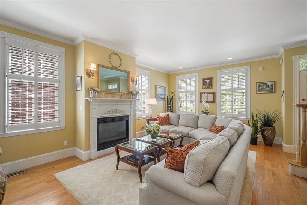 65 Rutherford Avenue Boston, MA 02129 - Photo 2 of 25 a living room with furniture and a fireplace