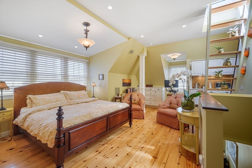 65 Rutherford Avenue Boston, MA 02129 - Photo 6 of 25 a bedroom with a bed and wooden floor