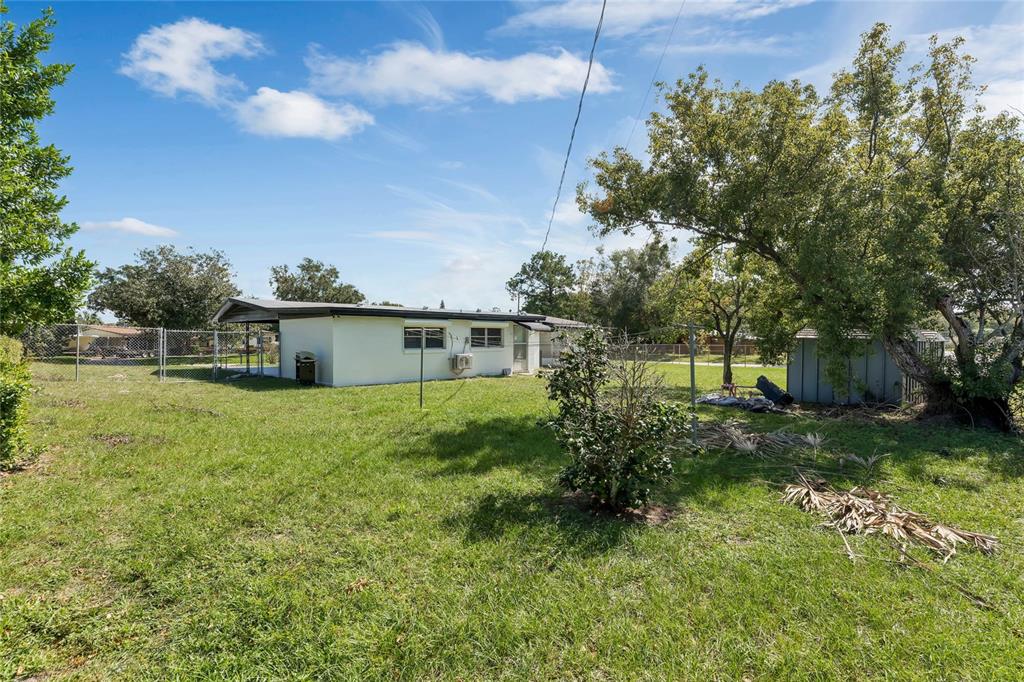 448 Ridge Drive Sanford, FL 32773 - Photo 19 of 20 a view of a house with a yard