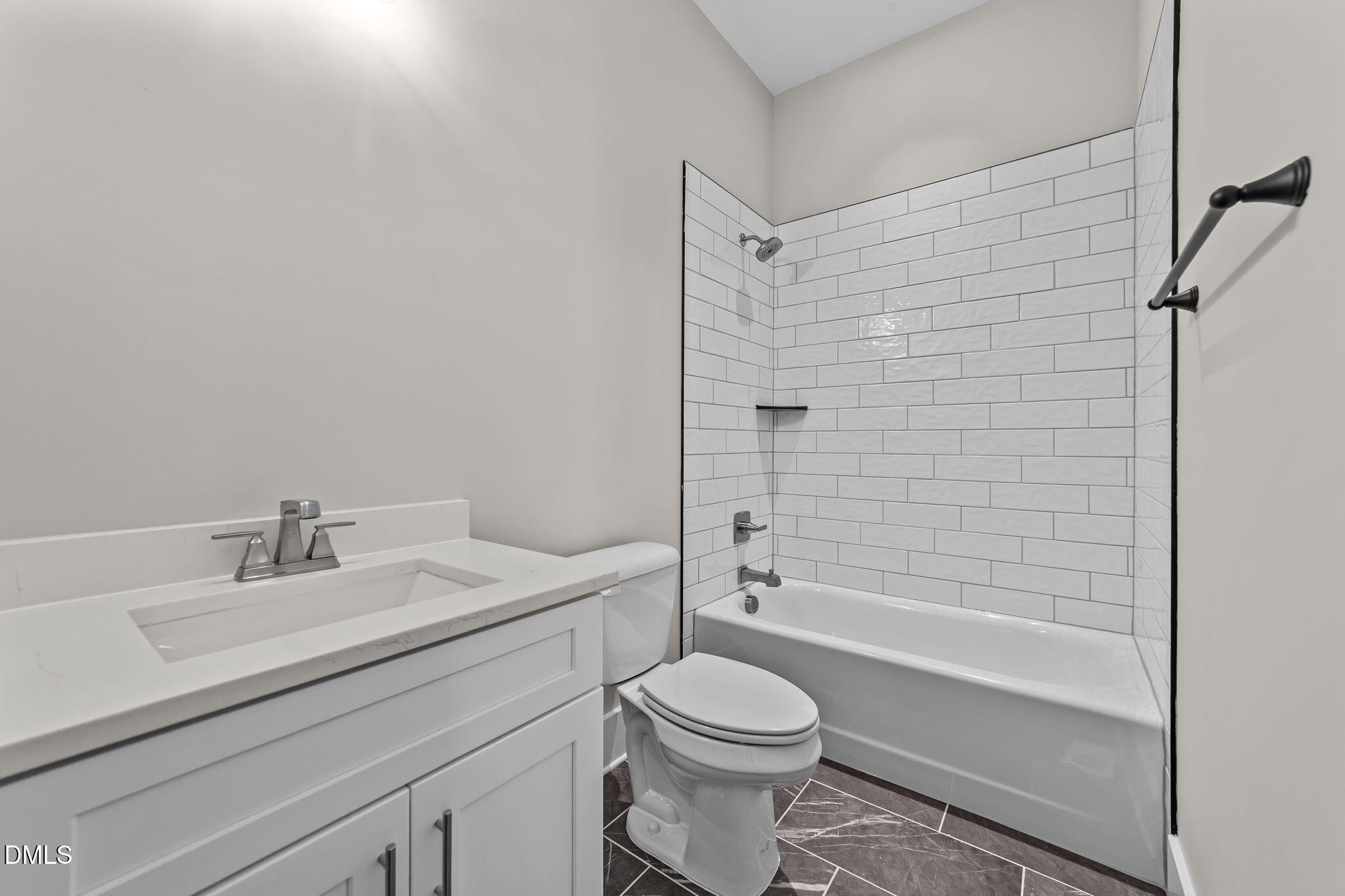 2568 Lassiter Road Four Oaks, NC 27524 - Photo 15 of 45 a bathroom with a sink a toilet and shower