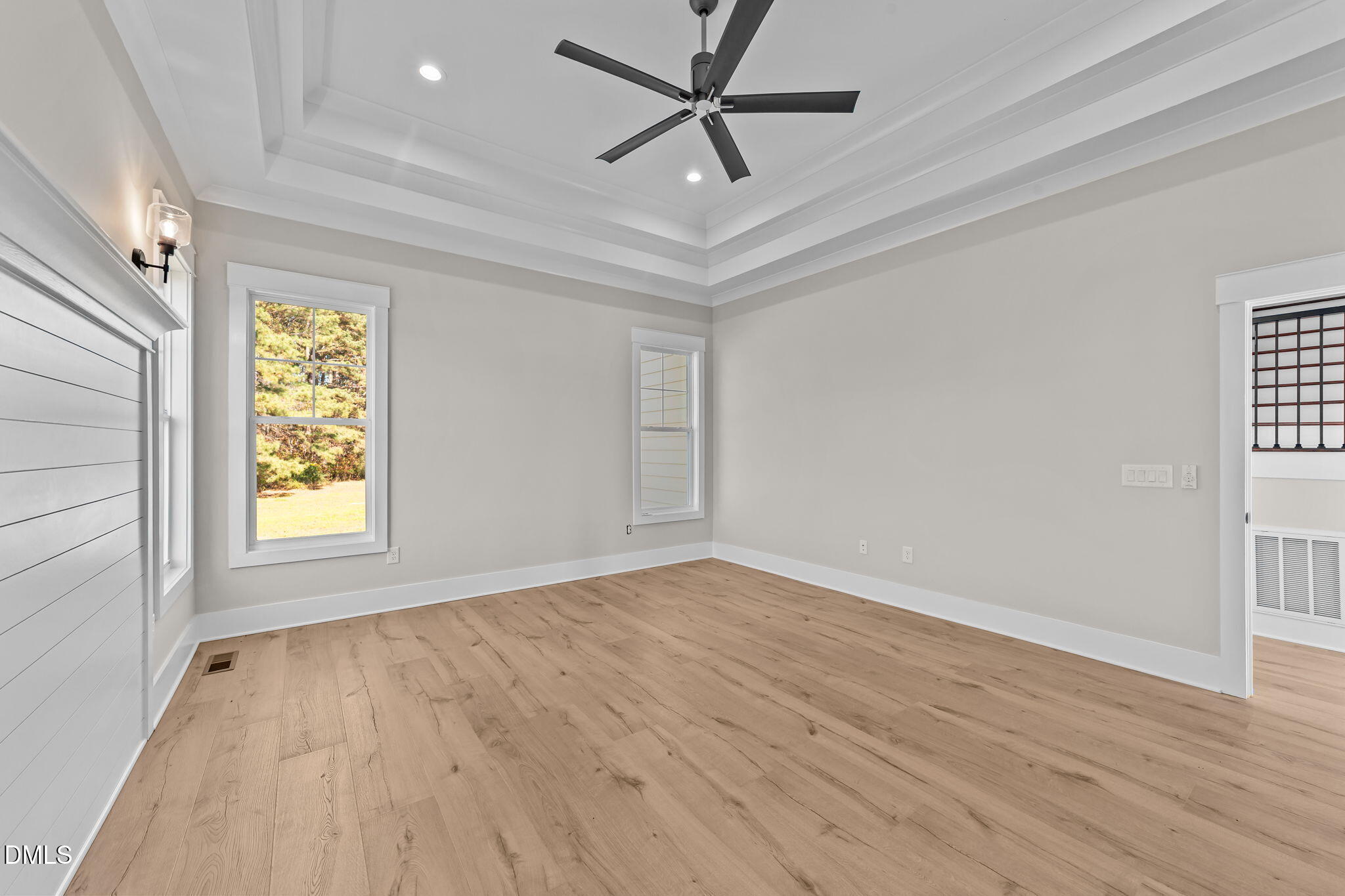 2568 Lassiter Road Four Oaks, NC 27524 - Photo 20 of 45 wooden floor in an empty room with a window