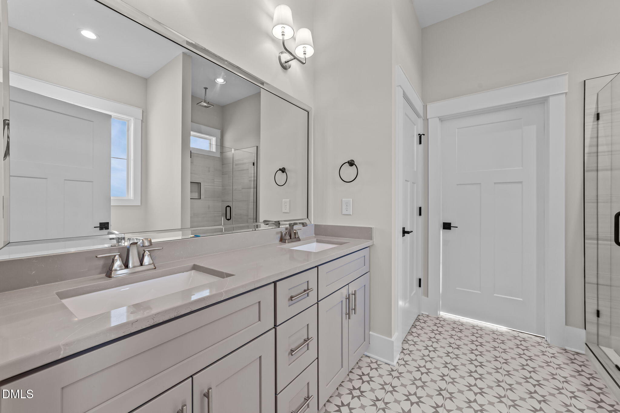 2568 Lassiter Road Four Oaks, NC 27524 - Photo 21 of 45 a bathroom with a sink a shower a mirror and a bathtub