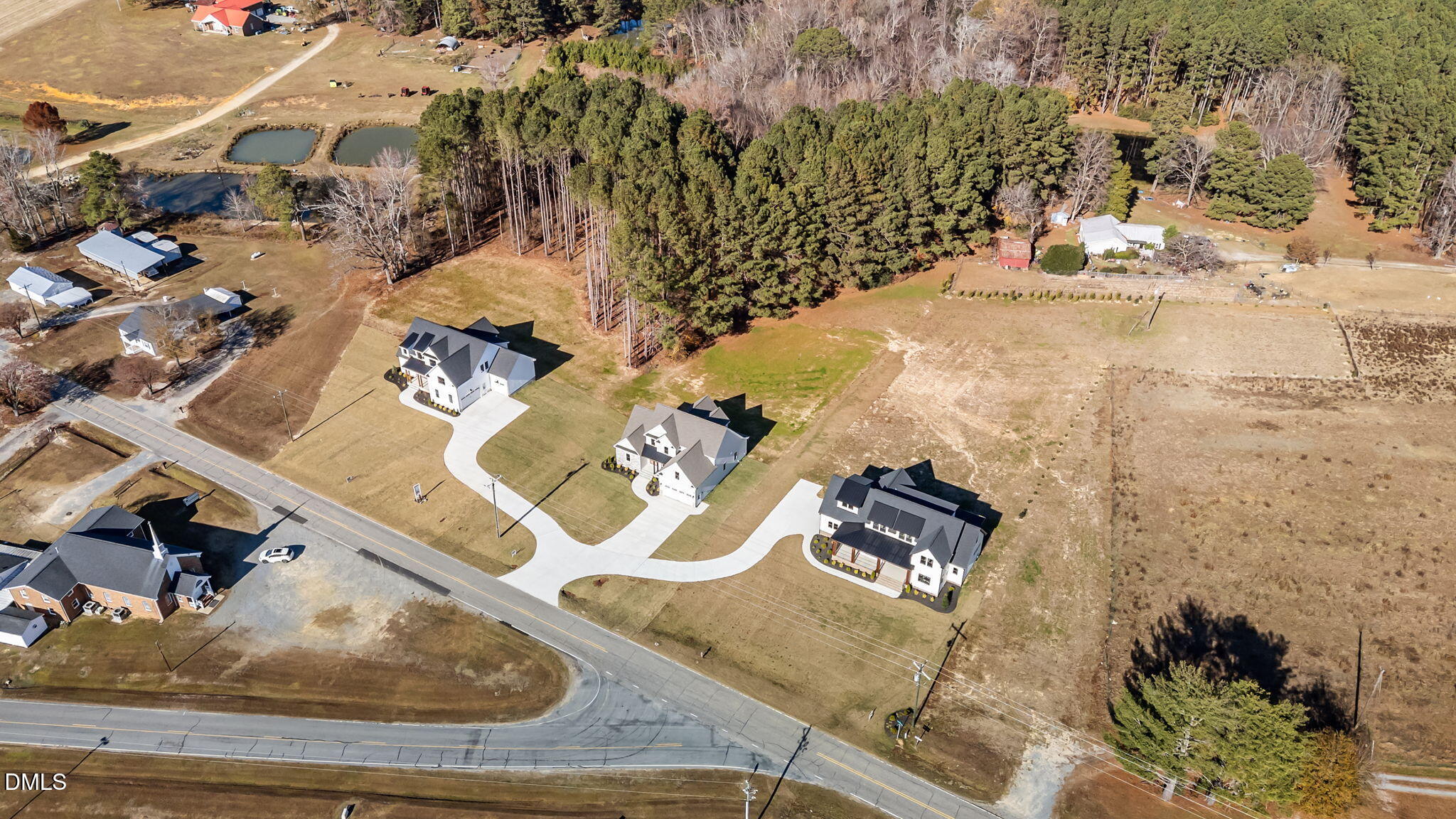 2568 Lassiter Road Four Oaks, NC 27524 - Photo 44 of 45 an aerial view of a house with a yard