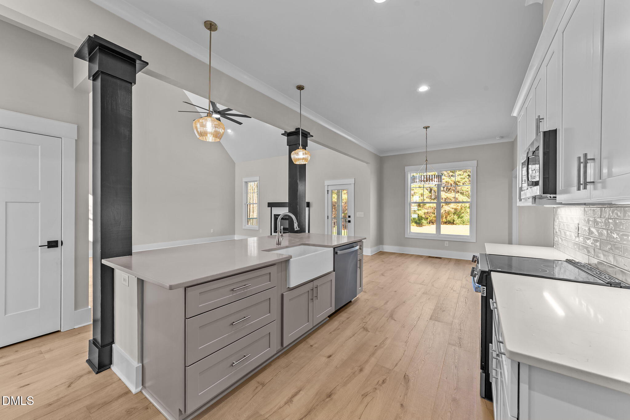 2568 Lassiter Road Four Oaks, NC 27524 - Photo 9 of 45 a large kitchen with a lot of counter space and a wooden floor